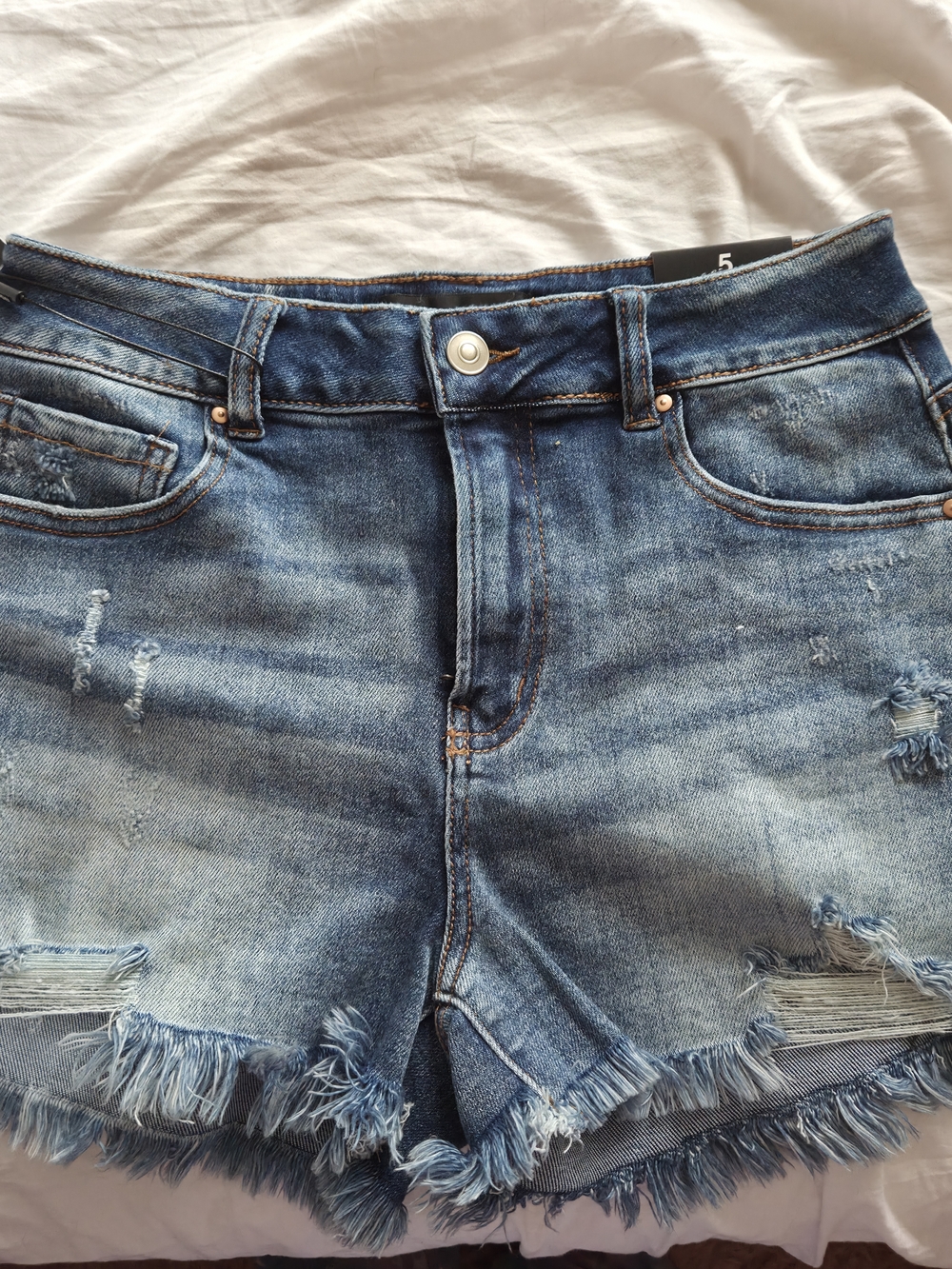 Fashion Nova Frayed denim shorts size 5
